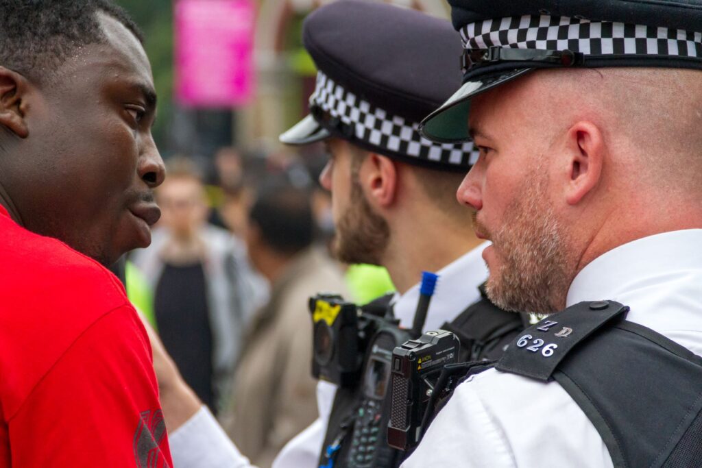 UK police with black man